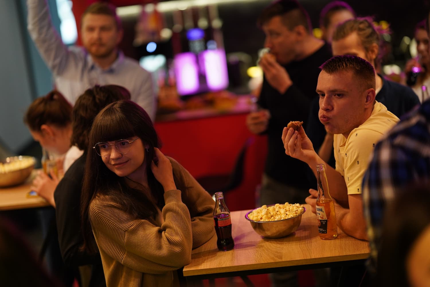 Serhii Shramko enjoying snacks and drinks with friends at a lively party